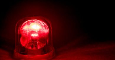 Emergency rotating alarm red light at night.