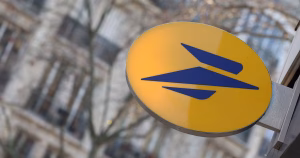 (FILES) This photograph shows a logo of La Poste at a French post office in Paris, on January 10, 2024. La Poste online services are "inaccessible" following a cyberattack, the group announced on December 22, 2025. (Photo by ALAIN