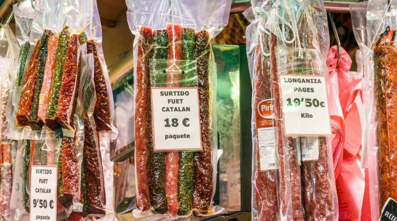 Spain, Barcelona, Mercat de la Boqueria, public market, sausage vendor display