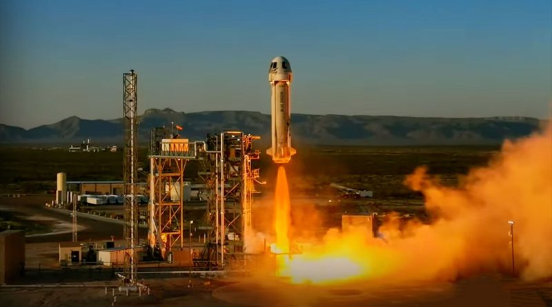 a white rocket lifts off from a desert launch site into the dawn sky