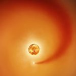 This artist&rsquo;s concept shows the red supergiant star Betelgeuse and an orbiting companion star. The companion, which is orbiting clockwise from this point of view, generates a dense wake of gas that expands outward.