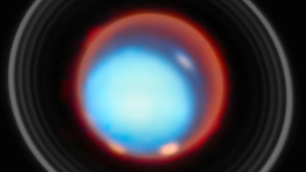 A blue circle with a red outline surrounded by white rings.