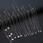 Un ensemble de 12 colliers minimalistes en fausse perle en forme d'étoile, de cœur et de serpent, parfaits pour les vacances des femmes, les cadeaux de sortie et les tenues de tous les jours.