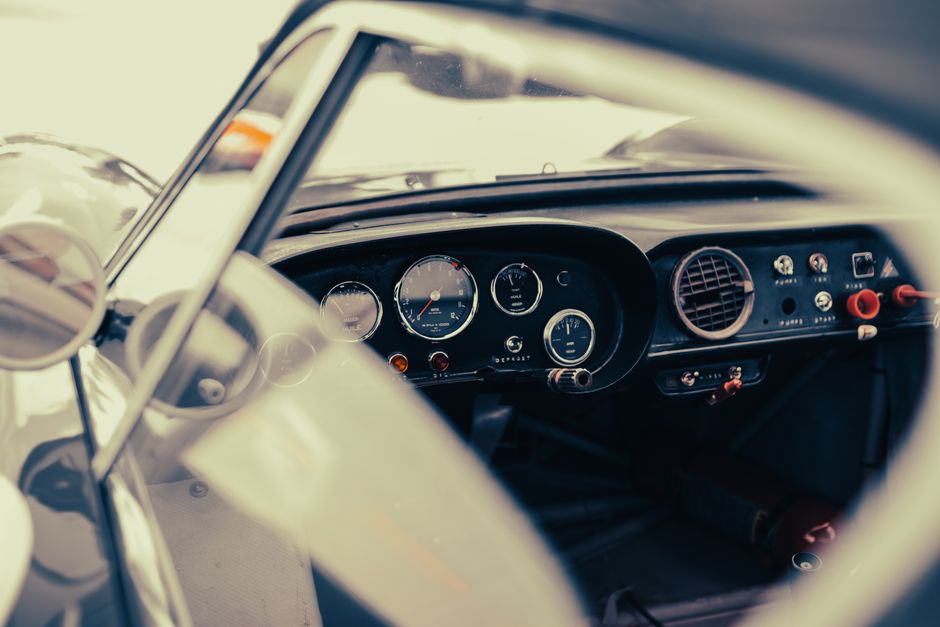 Close-up of a vintage car dashboard showcasing classic design at Le Mans, France.