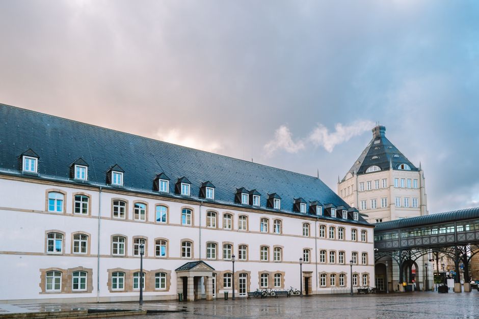 Elegant court building in Luxembourg City on a cloudy day, showcasing historic architecture.