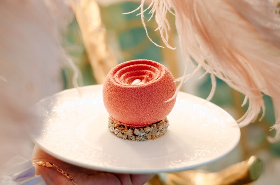 Close-up of a beautifully crafted dessert with textured topping, perfect for gourmet dining concepts.
