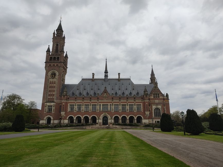 Stunning view of the Peace Palace in The Hague under a cloudy sky.