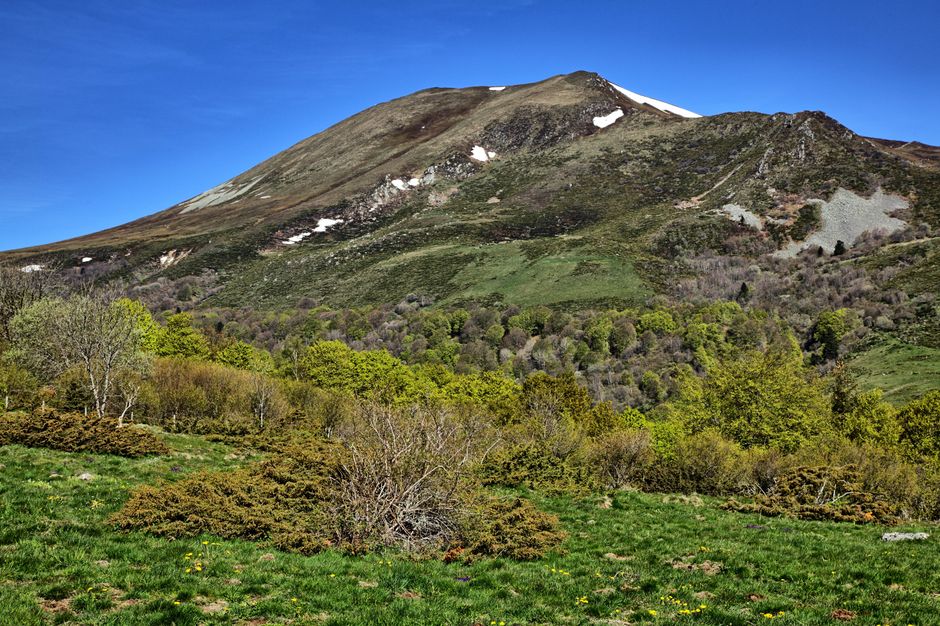 Beautiful summer landscape of Montagne de la Croix with clear blue skies and lush greenery.
