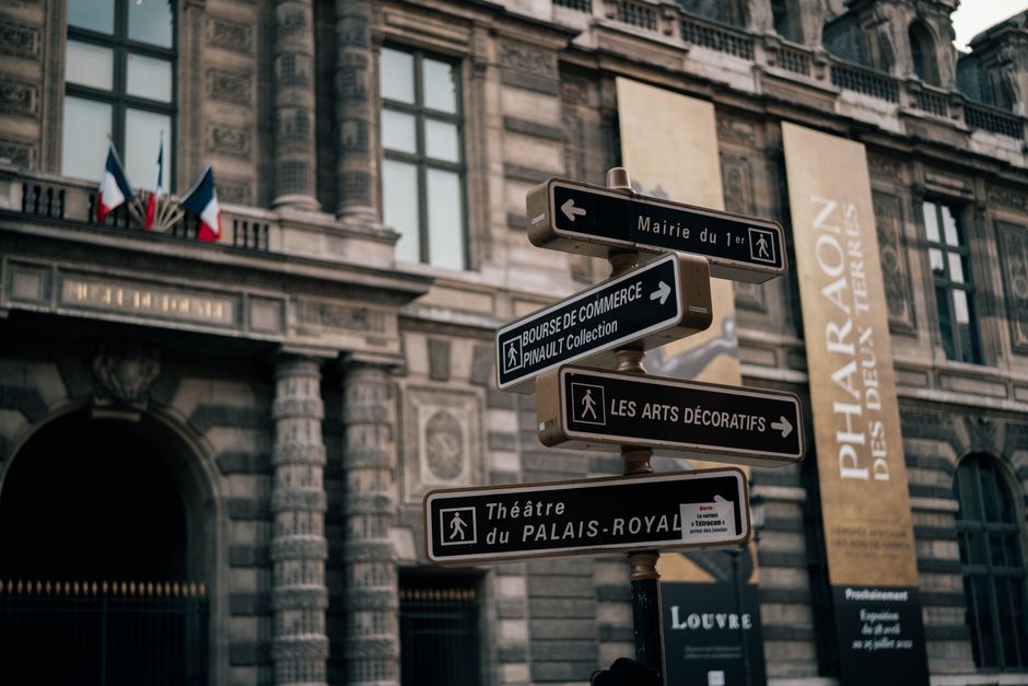 Street signs near historic Palais Royal in Paris, France. Architectural elegance and cultural landmarks.