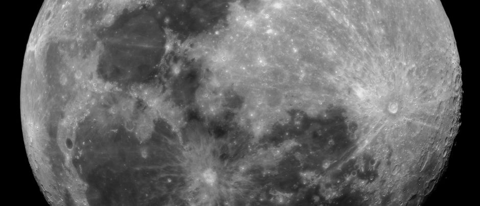 Close-up black and white image of the Moon's surface with visible craters from São Pedro de Alcântara.