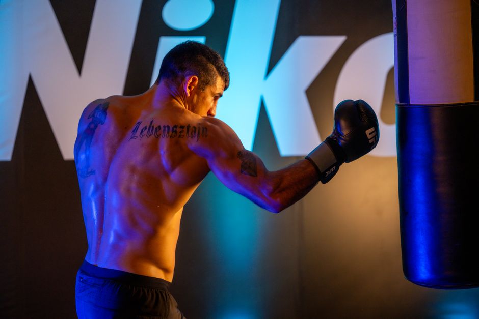 A determined boxer working out in a Mexico City gym, showcasing strength and focus.