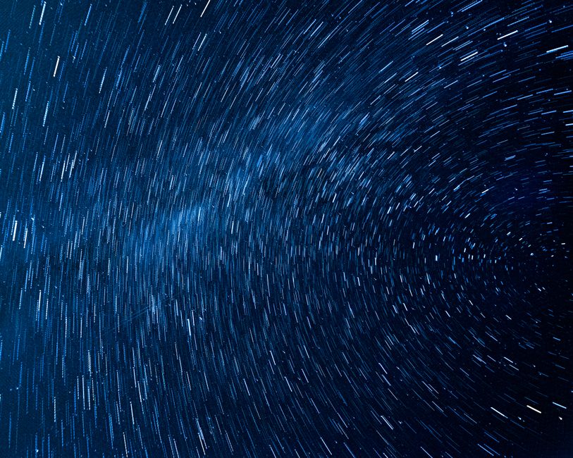 Captivating view of rotating star trails in a clear night sky, captured from Pont-a-Celles, Belgium.