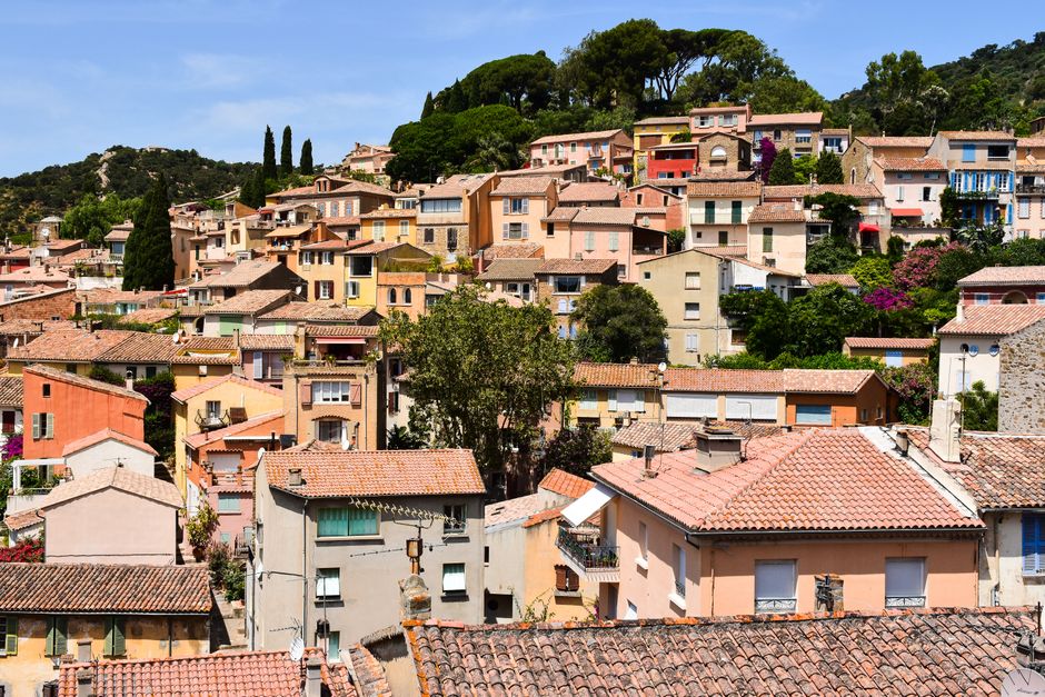 Picturesque view of Bormes-les-Mimosas with colorful houses and lush greenery in France.