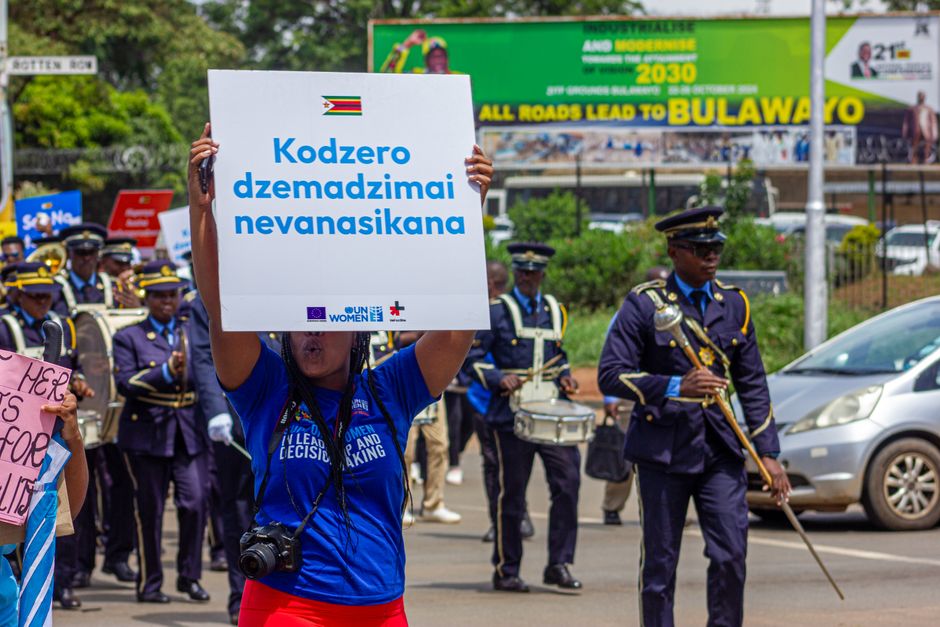 Women's rights march in Harare, Zimbabwe with banners promoting gender equality and human rights.