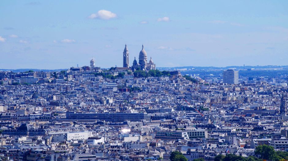 A picturesque aerial view of the Sacré-Cœur Basilica overlooking the city of Paris.