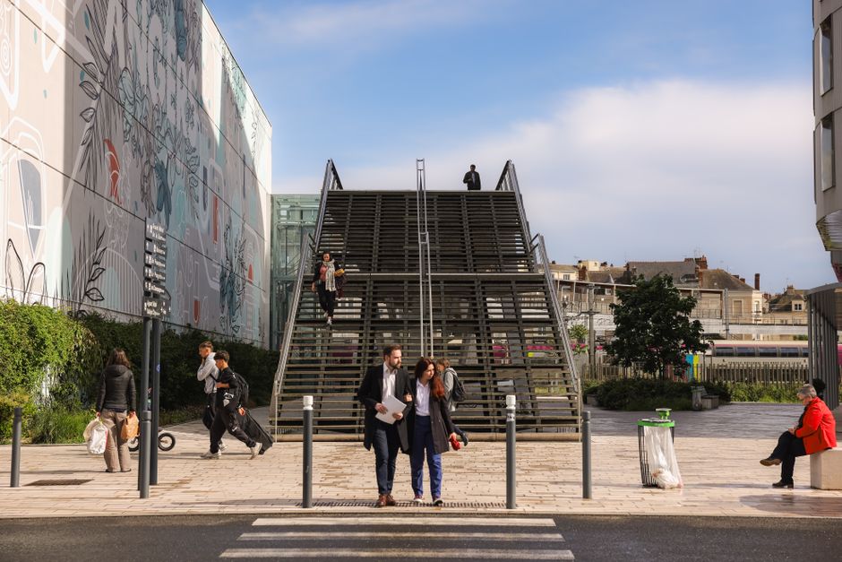 Vibrant urban life captured at a modern staircase in Angers, France.