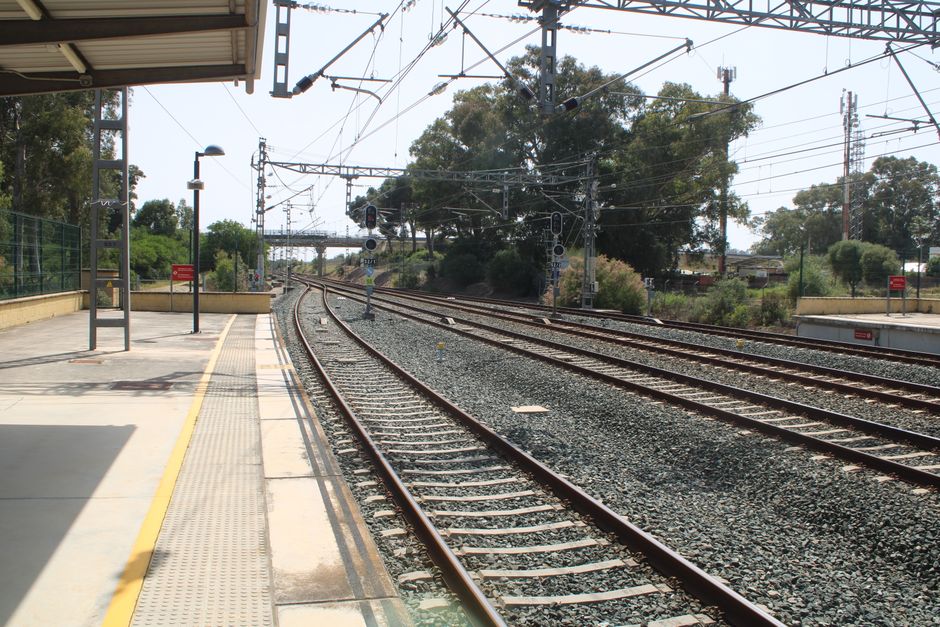Explore the serene view of railroad tracks at Jerez de la Frontera on a clear day.