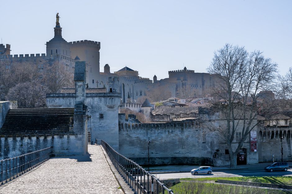 Scenic view of Avignon, France, featuring Pont Saint-Bénézet and Palais des Papes.