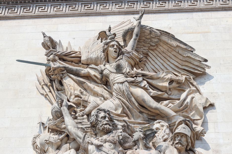 Close-up view of La Marseillaise sculpture on the Arc de Triomphe in Paris, depicting passionate French revolutionaries.