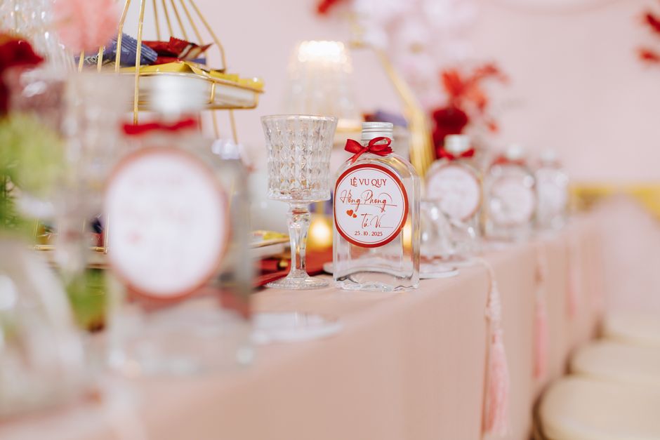Beautifully arranged table with decorative bottles and glassware for a special event.