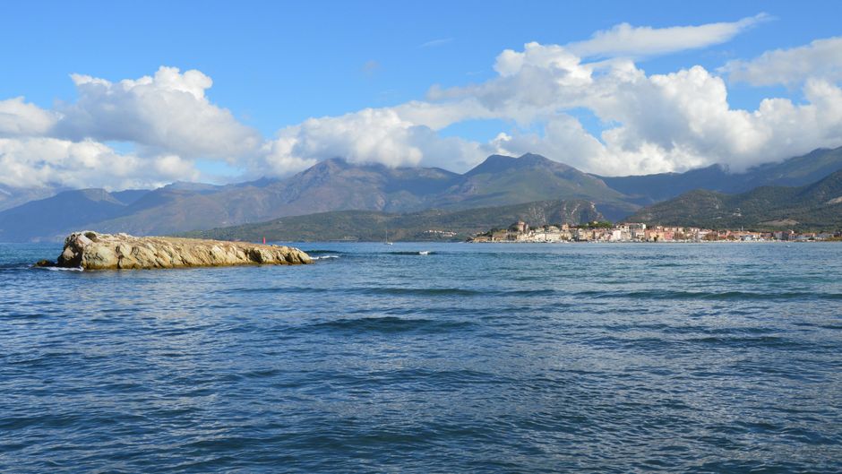 Breathtaking seaside landscape of Saint-Florent with mountains in the background, Corsica, France.