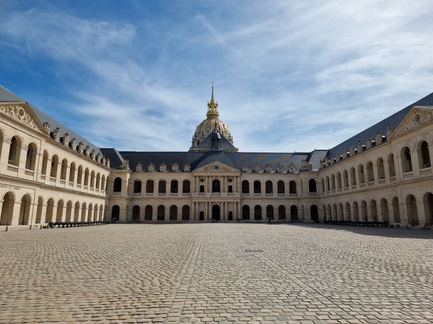 Captivating view of the historic Les Invalides courtyard in Paris, featuring classical French architecture.