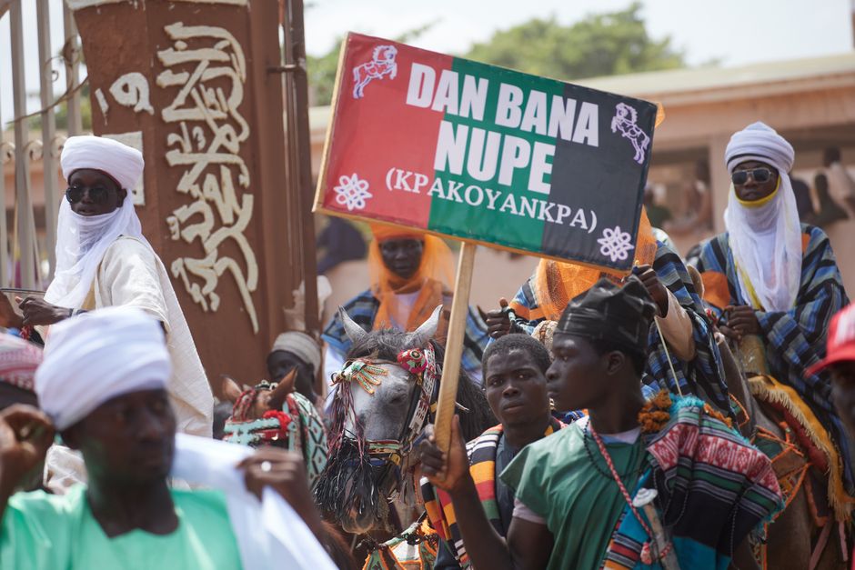 Vibrant Nupe cultural parade showcasing traditional attire and horse riding celebration.