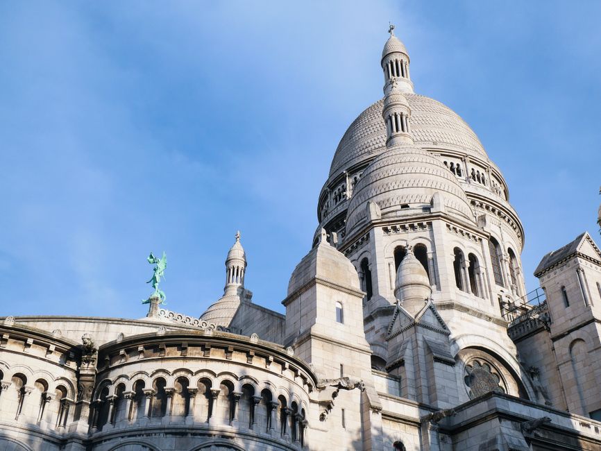 Beautiful view of the Sacre-Coeur Basilica's architectural design, captured under a clear blue sky.