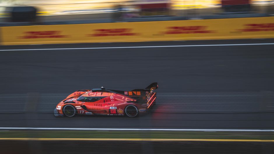 Fast-moving racing car on the Le Mans track during a thrilling motorsport event.