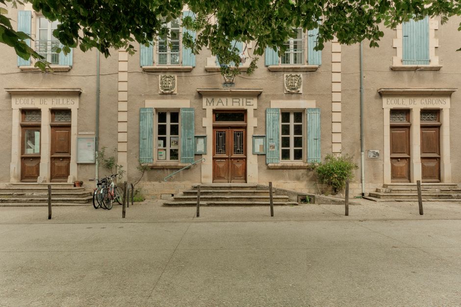 Front view of a traditional French town hall in Auvergne-Rhône-Alpes, France, during summer.