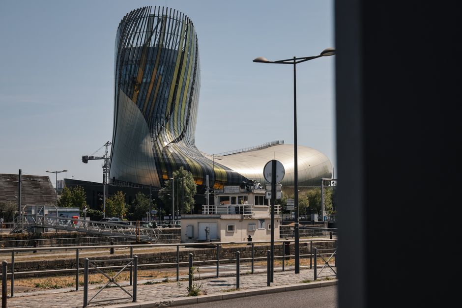 Modern architecture of La Cité du Vin in Bordeaux, France on a sunny day.