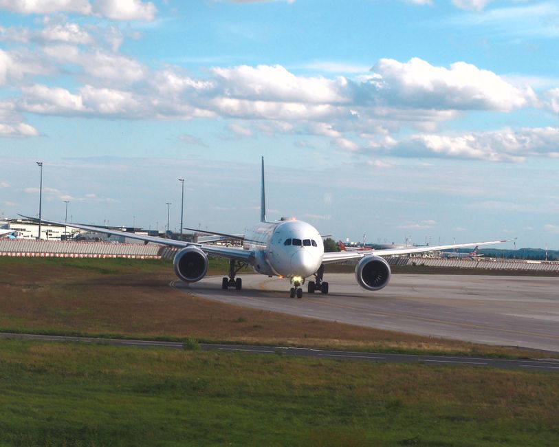 A large airplane taxiing on the runway at Charles de Gaulle Airport, Roissy-en-France, France.
