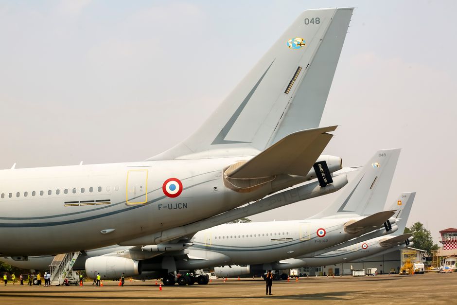 Multiple airplanes lined up at an airport in Jakarta, Indonesia.