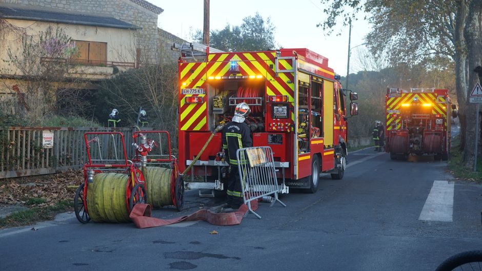 Firefighters intervene with trucks during an emergency in Montbazin, France.