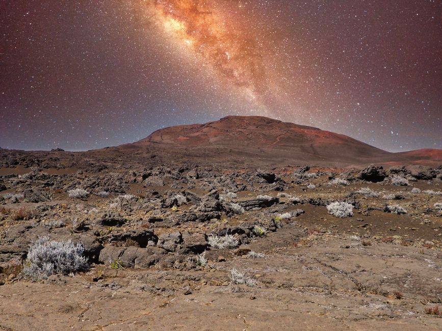 Vibrant Milky Way over the rugged landscape of Piton de la Fournaise, capturing the serene beauty of the volcanic terrain.