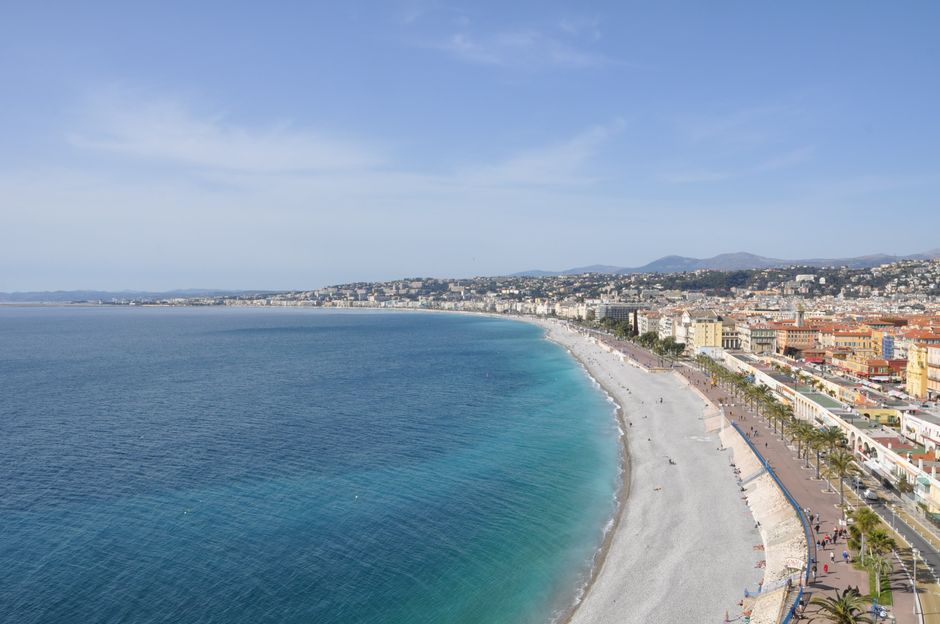 A stunning aerial view of Nice's beachfront along the French Riviera, showcasing the city's coastline.